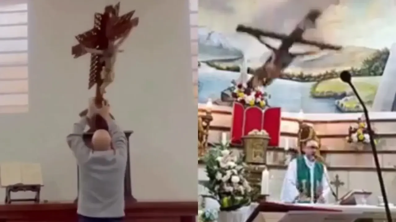 Sacerdote en una iglesia colombiana junto a una cruz de madera.